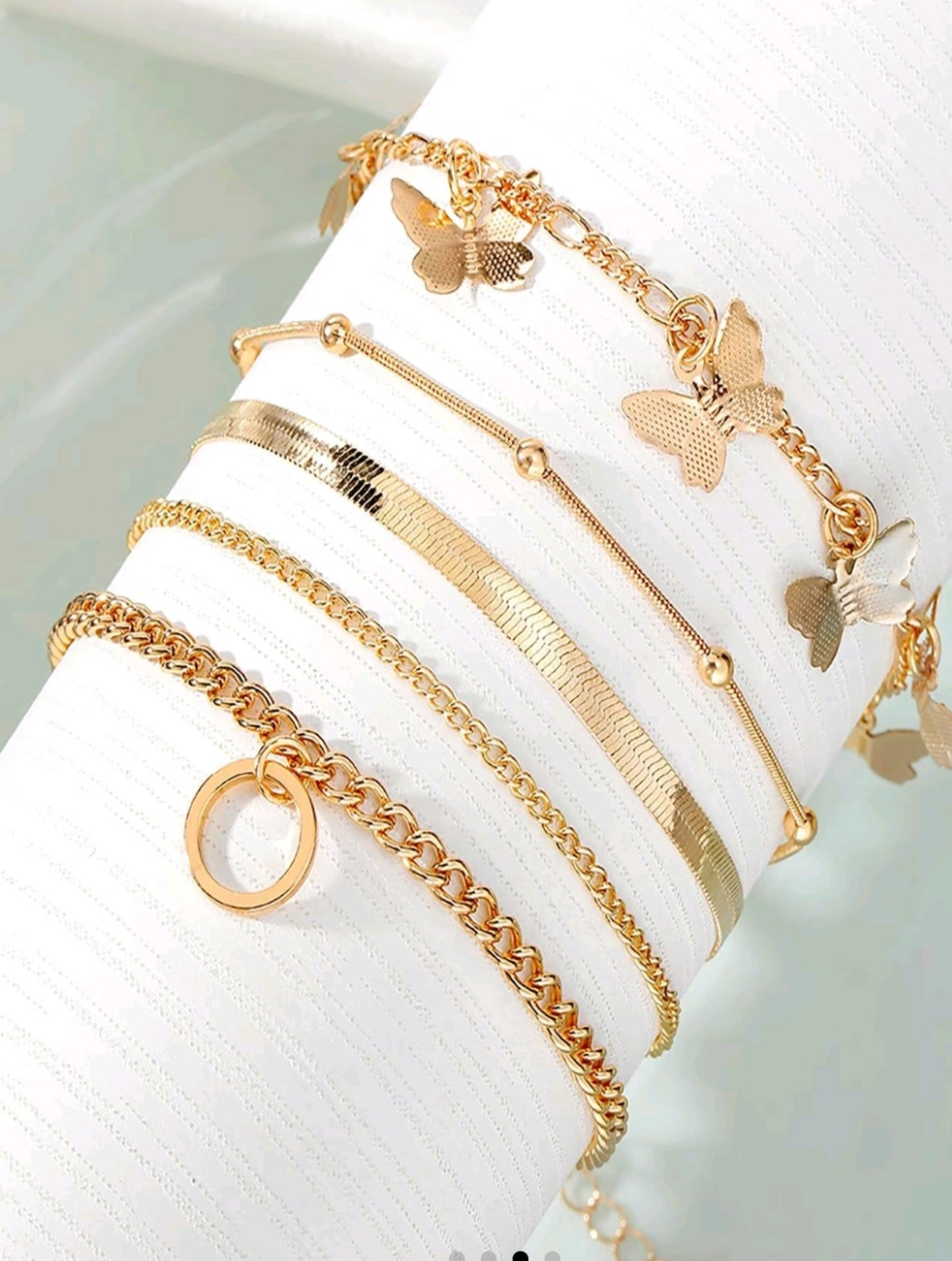 Butterfly charm bracelet five piece set can be worn on ankle as well.