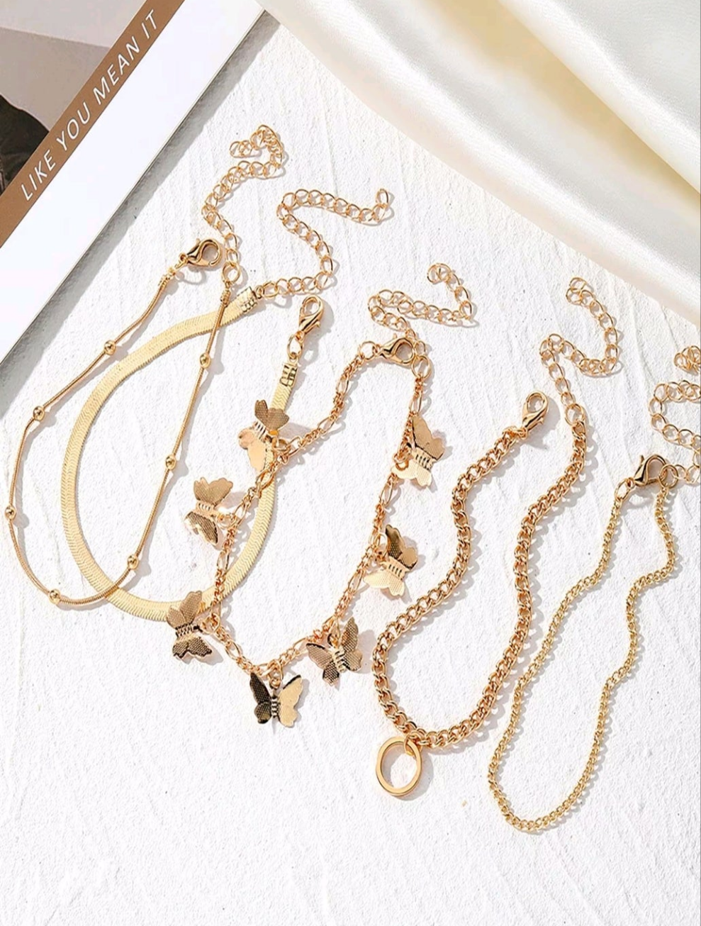 Butterfly charm bracelet five piece set can be worn on ankle as well.